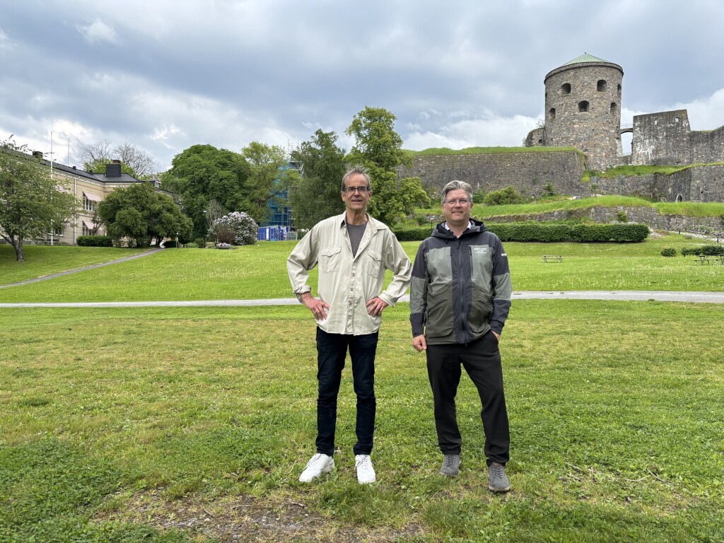 Project team in front of the fortress area during site inspection.